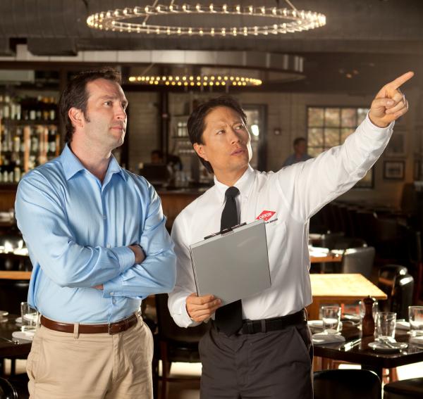 Orkin Pro providing pest control at a restaurant